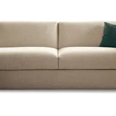 Canapé convertible beige, un coussin vert à motifs. Idéal pour la maison convertible, avis positif garanti.