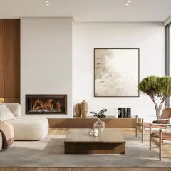 Salon moderne avec cheminée, canapé confortable et vue sur la nature. La hauteur du canapé est parfaite pour se détendre.