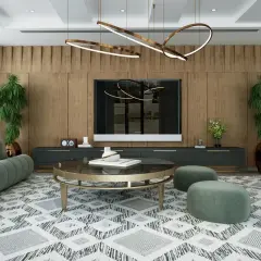 Un salon moderne avec un canapé vert, une table basse ronde et un tapis graphique. L'éclairage du salon est assuré par un lustre sculptural et des spots intégrés, créant une ambiance chaleureuse.