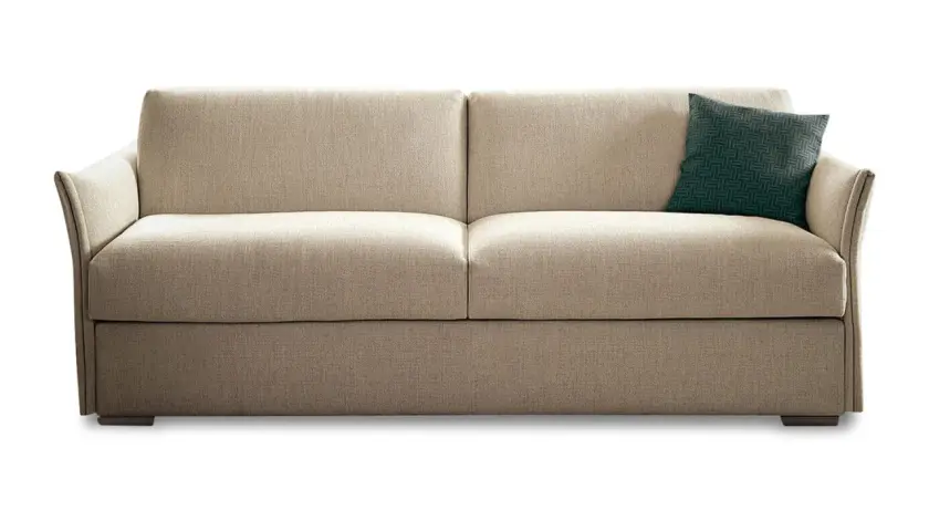 Canapé convertible beige, un coussin vert à motifs. Idéal pour la maison convertible, avis positif garanti.