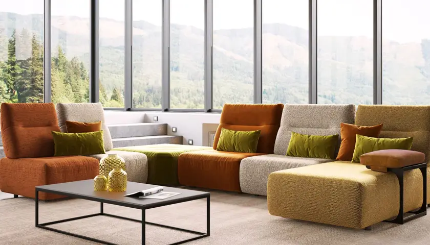 Un salon moderne avec un canapé modulaire aux couleurs vives. Le canapé réversible, signification de flexibilité, s'adapte à tous les espaces.
