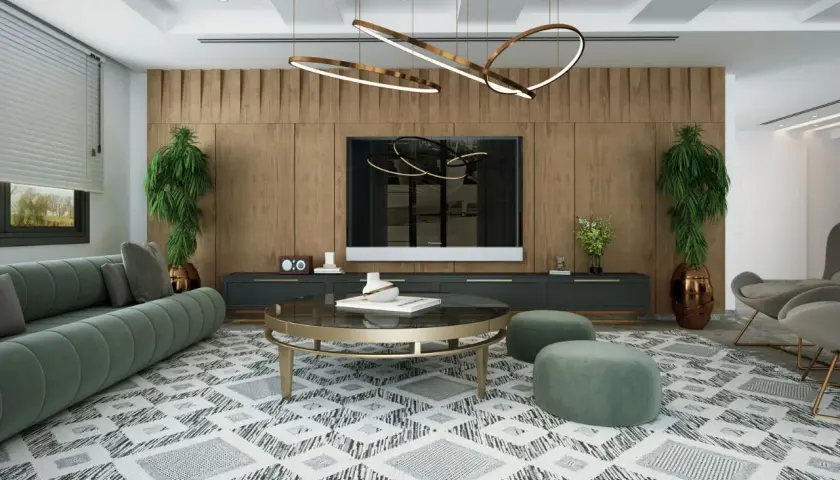 Un salon moderne avec un canapé vert, une table basse ronde et un tapis graphique. L'éclairage du salon est assuré par un lustre sculptural et des spots intégrés, créant une ambiance chaleureuse.