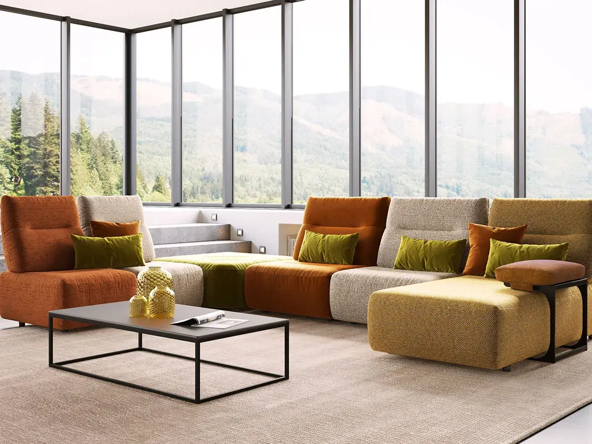 Un salon moderne avec un canapé modulaire aux couleurs vives. Le canapé réversible, signification de flexibilité, s'adapte à tous les espaces.