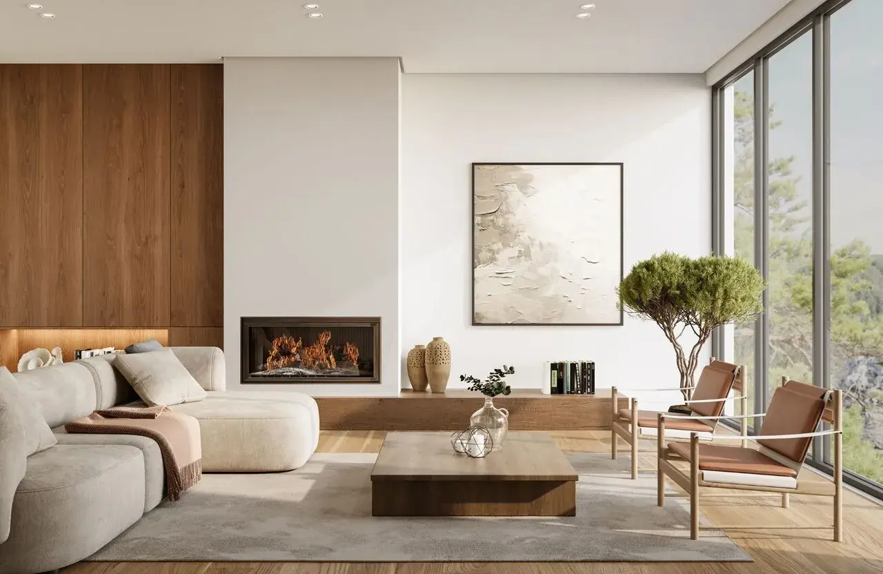 Salon moderne avec cheminée, canapé confortable et vue sur la nature. La hauteur du canapé est parfaite pour se détendre.
