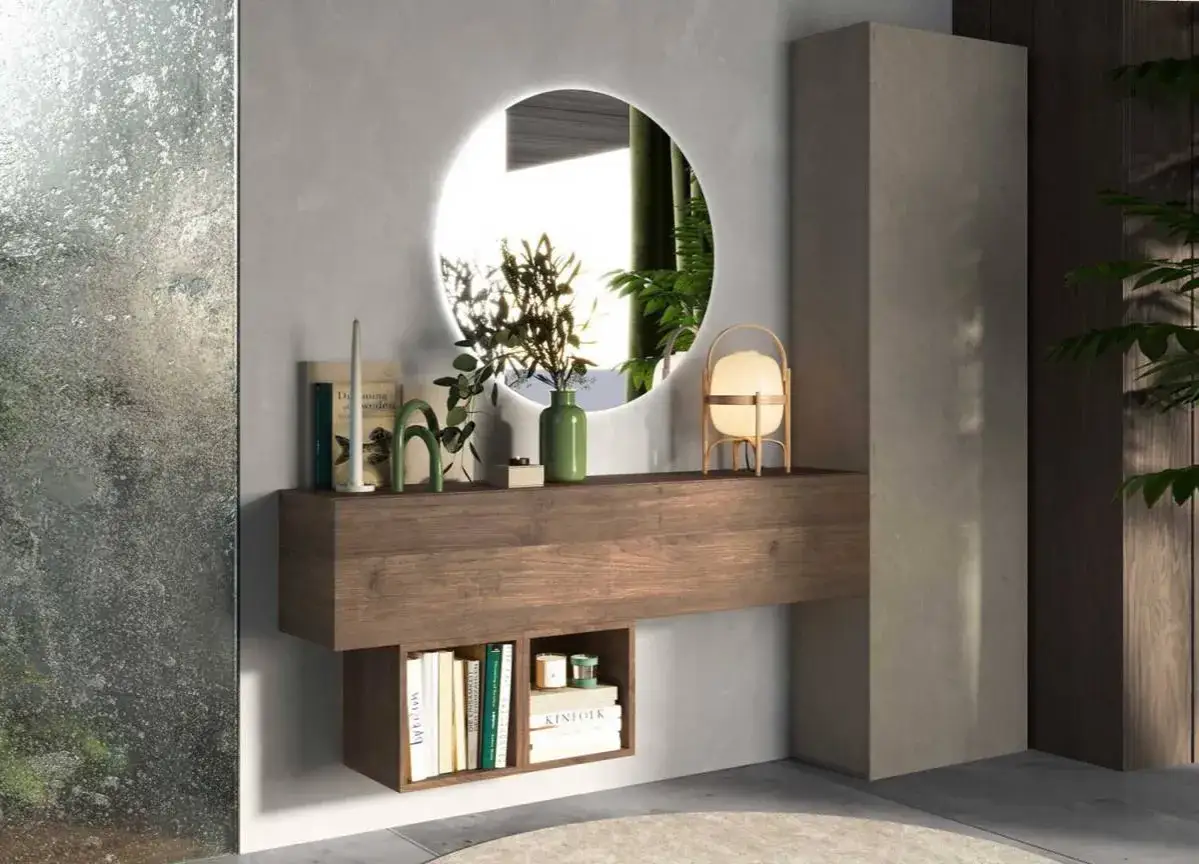 Élégante deco entree avec miroir rond lumineux, étagère en bois flottant et petite bibliothèque.